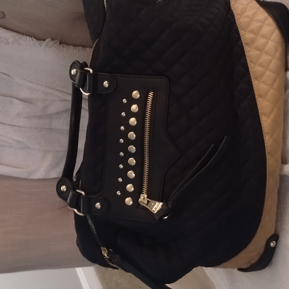 Beautiful Steve Madden tote bag. Great condition, but missing a stud.